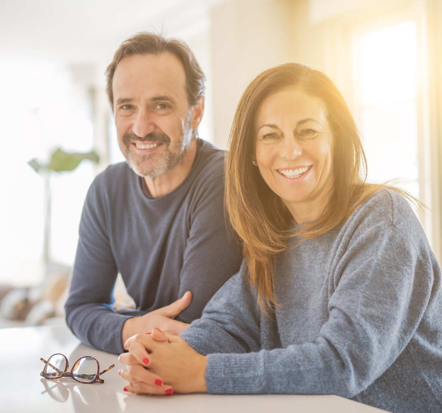 Happy middle aged couple thankful for a good nights sleep with treatment from Dr. Pick